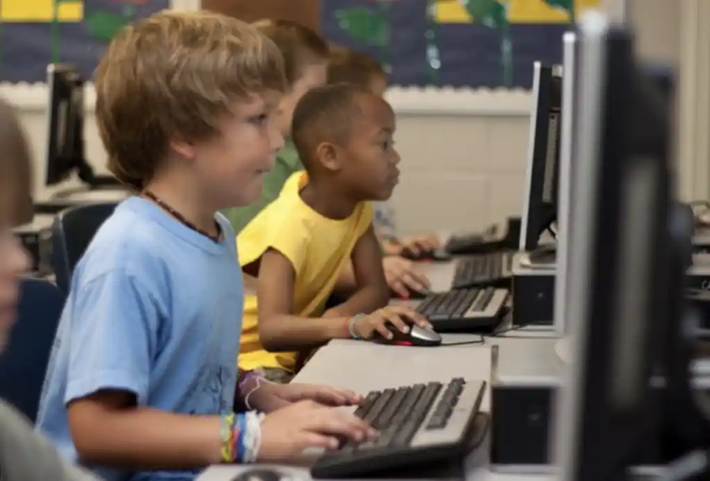 kids at school learning on computers